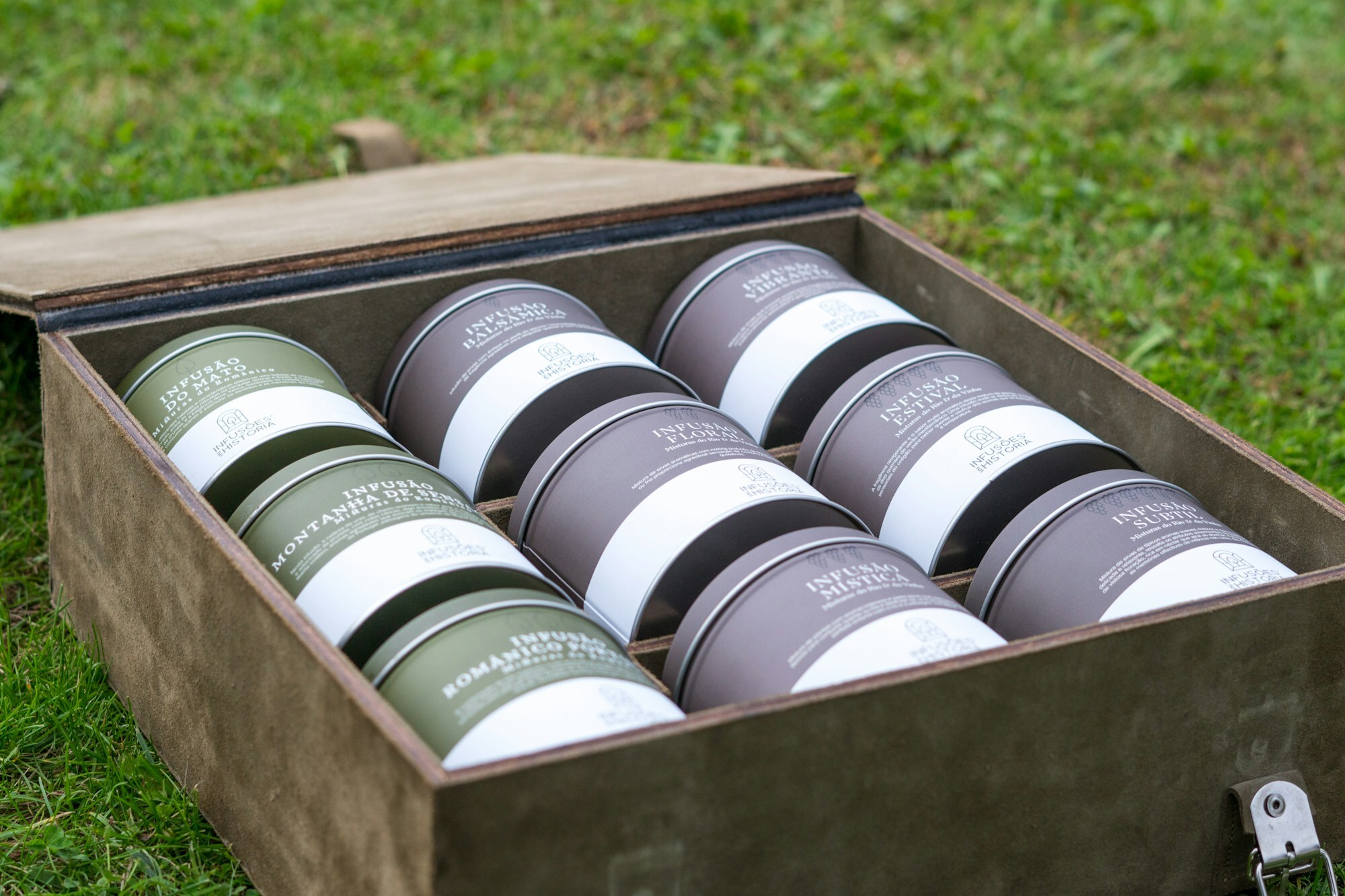 A wooden box filled with lots of different types of jars